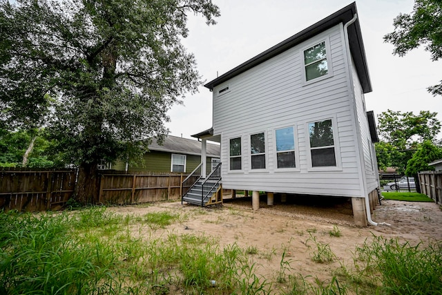 1415 E 35th St, Houston, TX 77022 - rear view of house with a fenced backyard