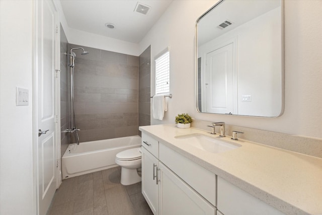 bathroom with toilet, bathtub / shower combination, visible vents, and vanity