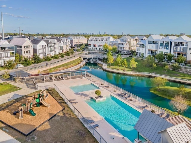 bird's eye view featuring a residential view and a water view