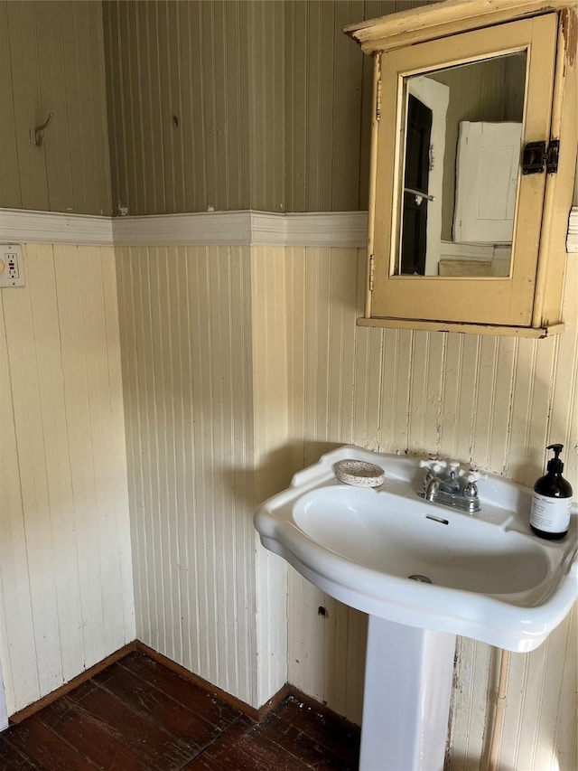 bathroom with wood-type flooring and sink