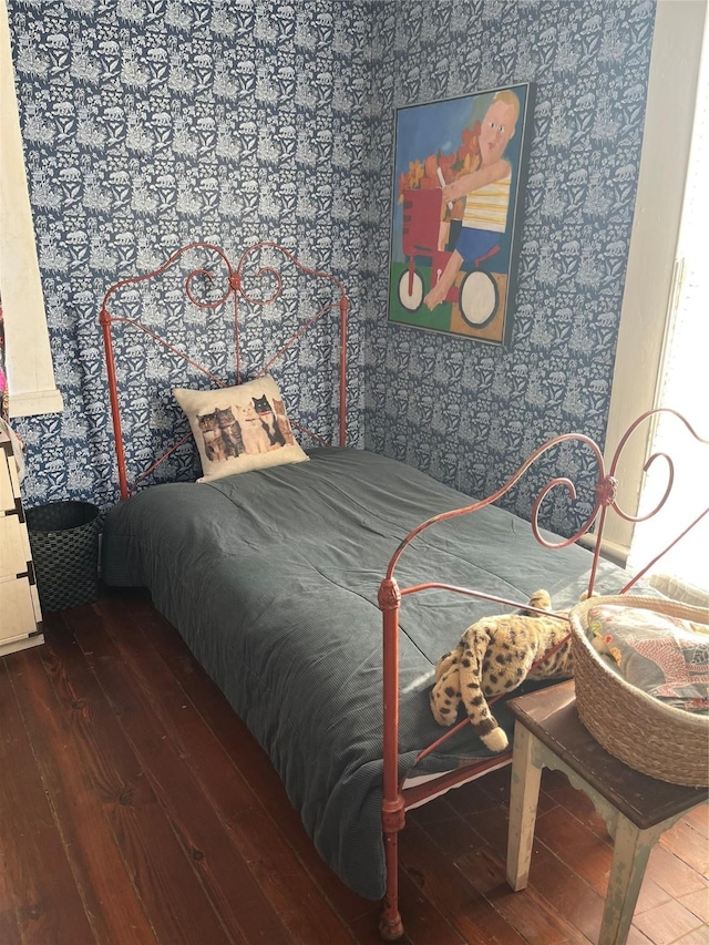 bedroom featuring dark hardwood / wood-style flooring