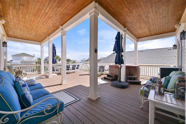 wooden deck with an outdoor living space