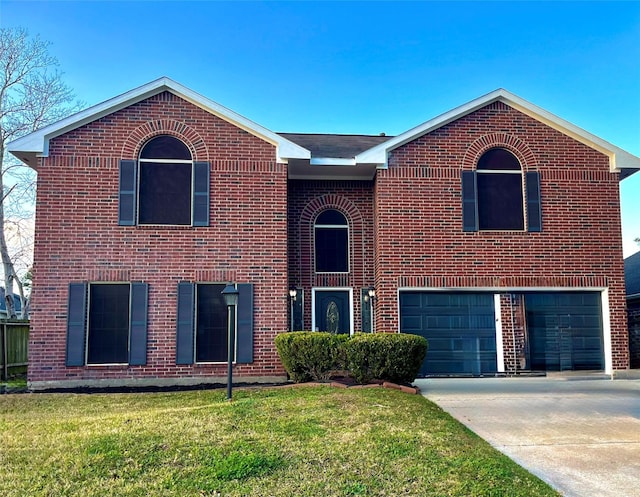 view of front of house with a garage and a front yard