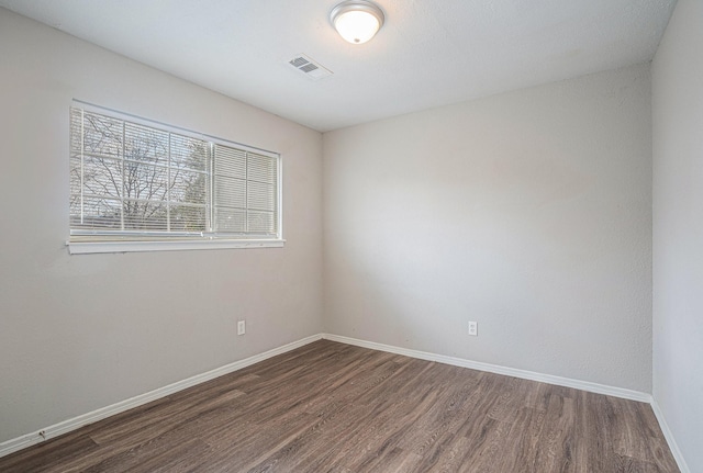 empty room featuring dark hardwood / wood-style floors