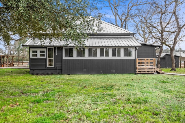 view of side of home featuring a lawn