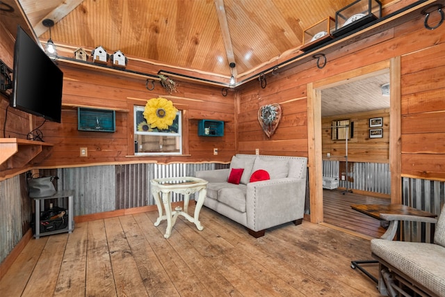 living room with hardwood / wood-style floors, wood ceiling, and wooden walls