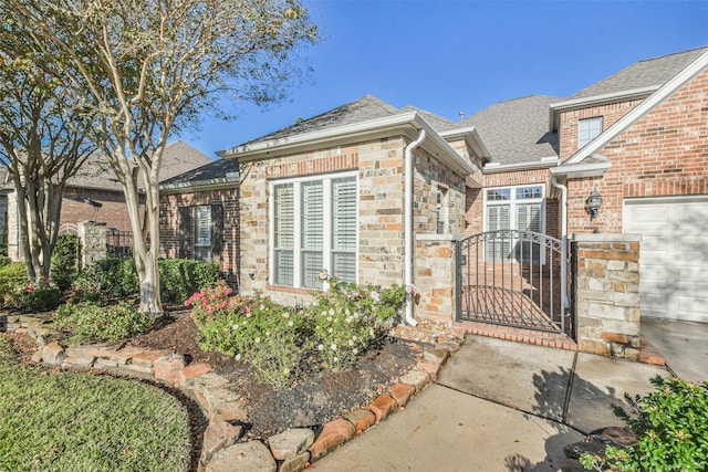 doorway to property featuring a garage