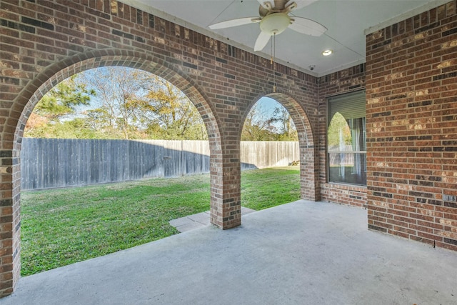 view of patio featuring ceiling fan