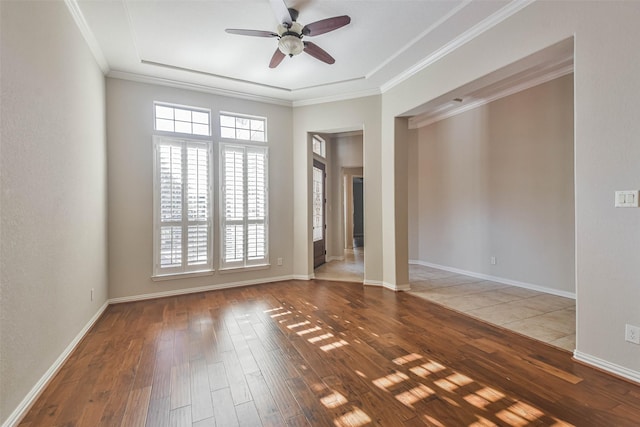 spare room with ornamental molding, hardwood / wood-style floors, and ceiling fan