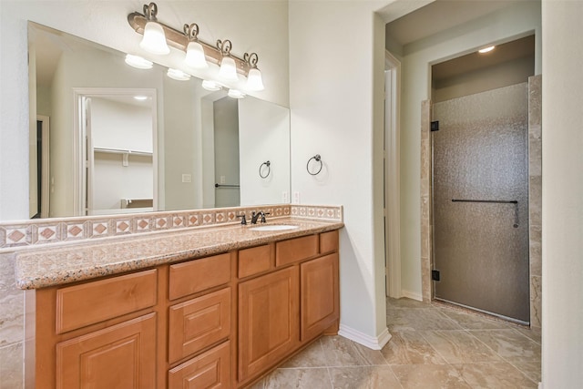 bathroom with vanity and an enclosed shower