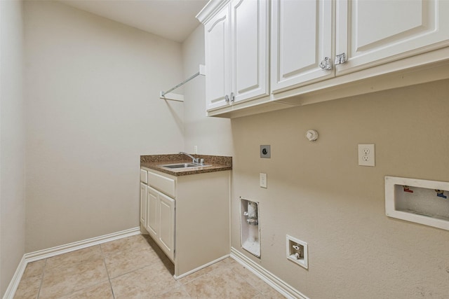 laundry area with gas dryer hookup, sink, cabinets, washer hookup, and electric dryer hookup