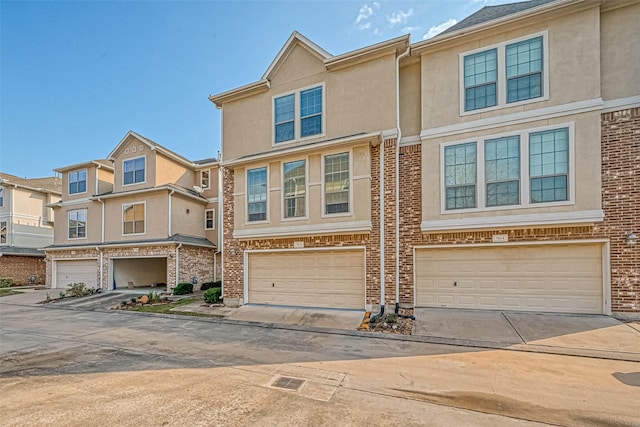 multi unit property featuring a garage