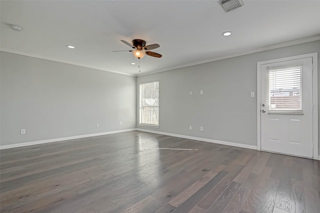 unfurnished room with crown molding, dark wood-type flooring, and ceiling fan
