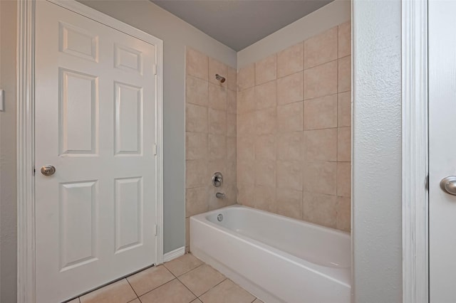 bathroom featuring tiled shower / bath combo and tile patterned floors