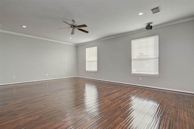 unfurnished room featuring dark wood-type flooring, ceiling fan, and crown molding