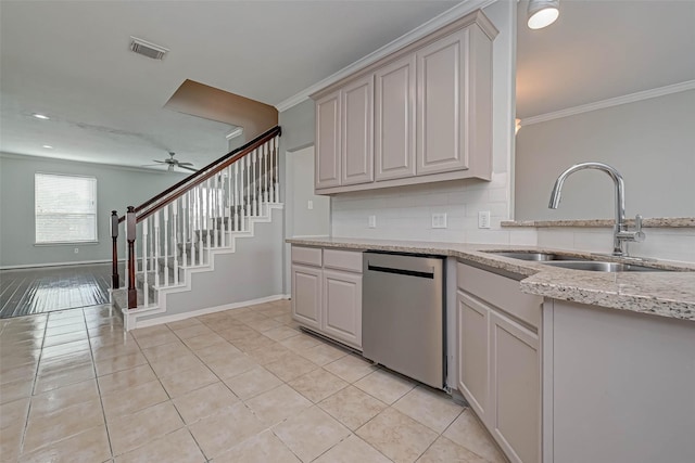 kitchen with sink, crown molding, light tile patterned floors, dishwasher, and backsplash