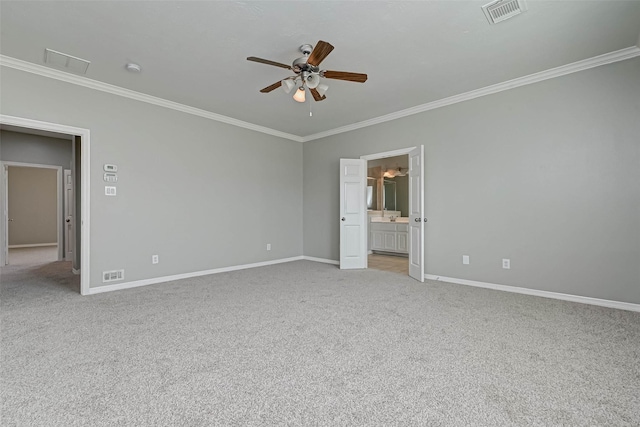 unfurnished bedroom with ornamental molding, connected bathroom, light carpet, and ceiling fan