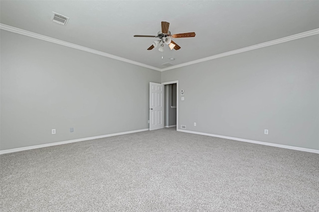 unfurnished room with crown molding, carpet flooring, and ceiling fan