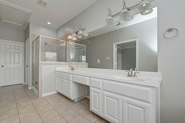 bathroom featuring vanity, tile patterned flooring, and a shower with shower door