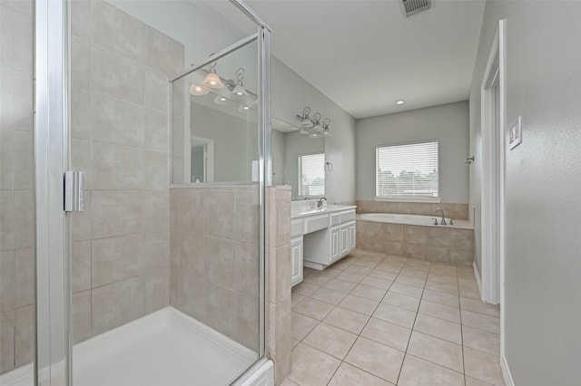 bathroom featuring vanity, tile patterned floors, and independent shower and bath