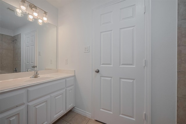 7816 Stoneyway Dr, Houston, TX 77040 - full bath featuring tile patterned flooring, a tile shower, vanity, and baseboards