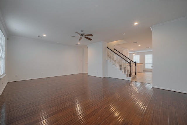7816 Stoneyway Dr, Houston, TX 77040 - unfurnished living room featuring stairway, hardwood / wood-style floors, a ceiling fan, ornamental molding, and baseboards