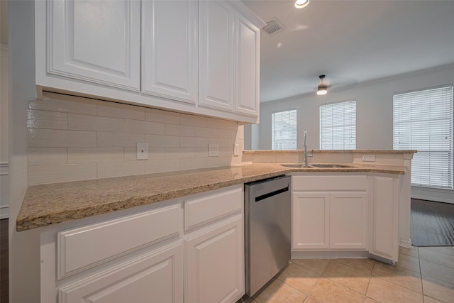 7816 Stoneyway Dr, Houston, TX 77040 - kitchen with stainless steel dishwasher, a sink, ceiling fan, white cabinetry, and recessed lighting