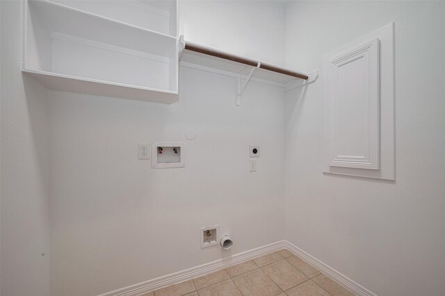 7816 Stoneyway Dr, Houston, TX 77040 - clothes washing area with gas dryer hookup, hookup for an electric dryer, hookup for a washing machine, baseboards, and light tile patterned floors