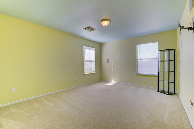 empty room with light colored carpet