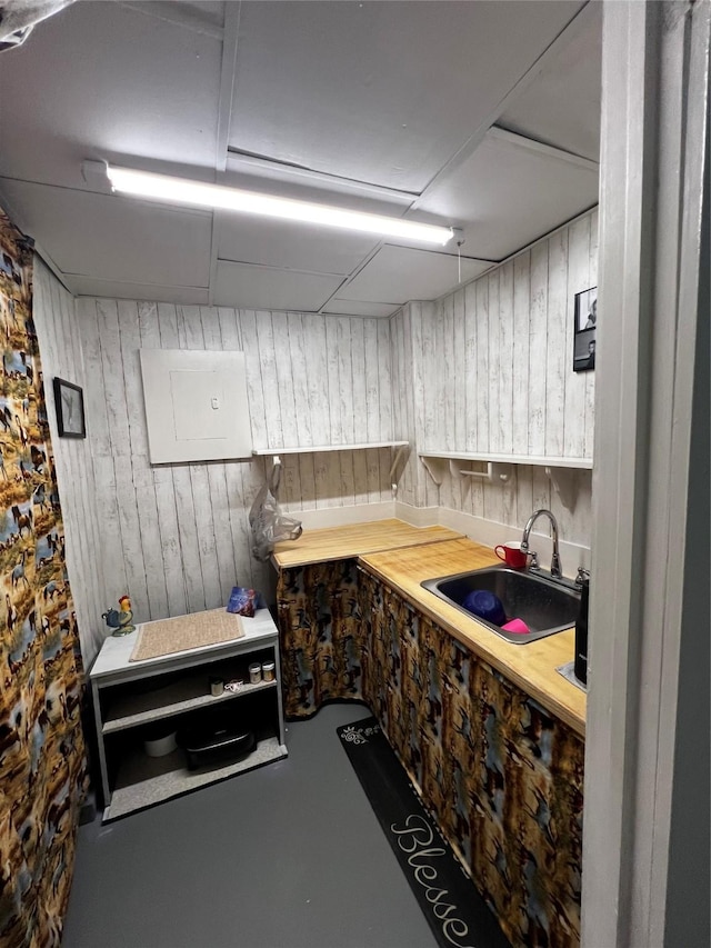 kitchen featuring sink and concrete floors