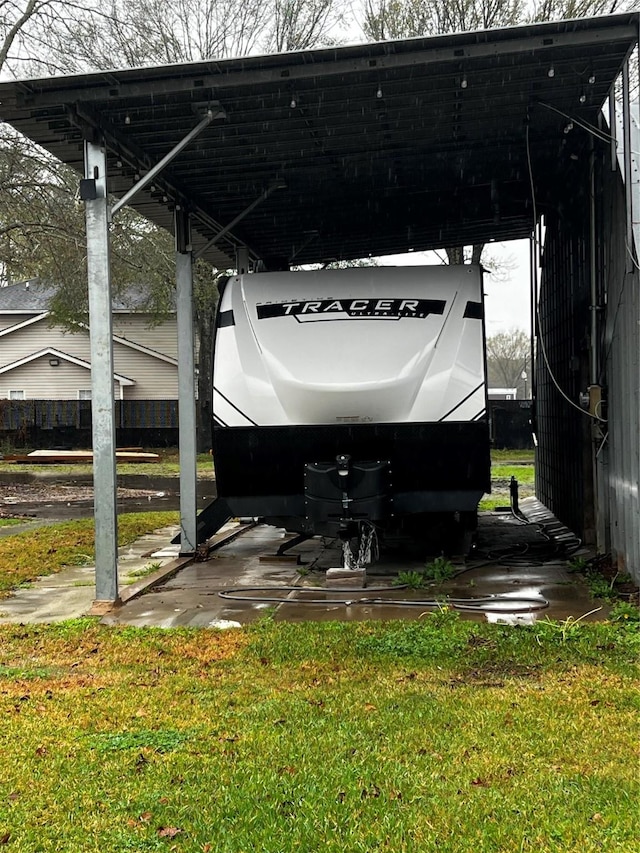 exterior space with a carport