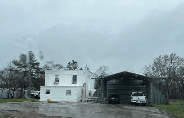 rear view of house with a carport