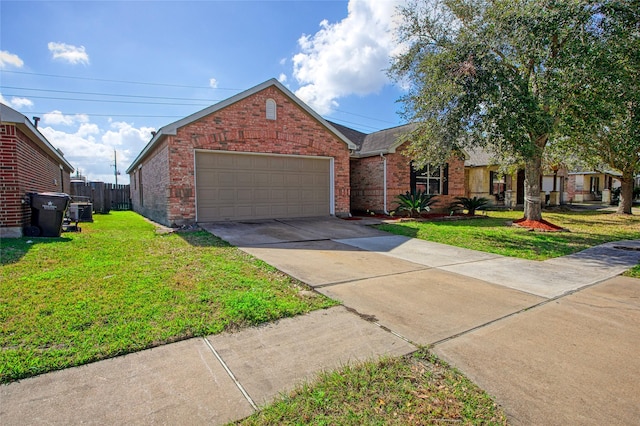 view of front of home with a garage and a front yard