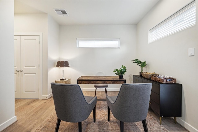 home office with wood-type flooring