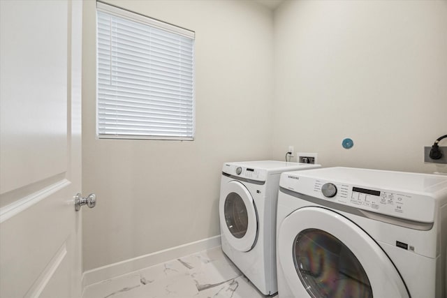 laundry area with independent washer and dryer