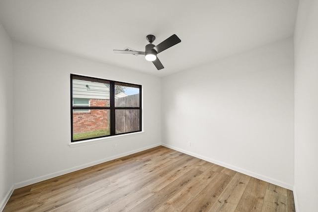 spare room featuring ceiling fan and light hardwood / wood-style flooring