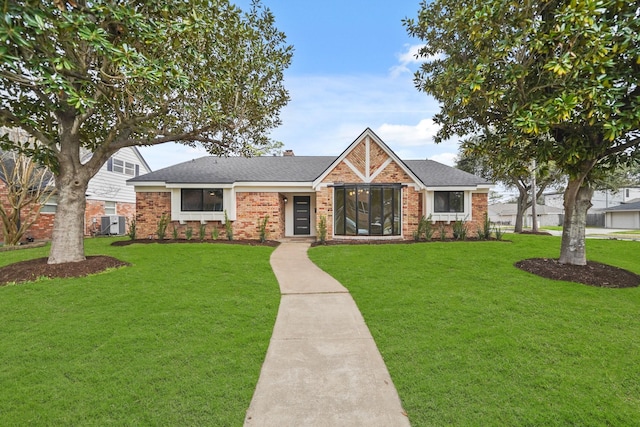 view of front facade with central AC unit and a front lawn