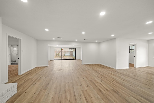 unfurnished living room with light wood-type flooring