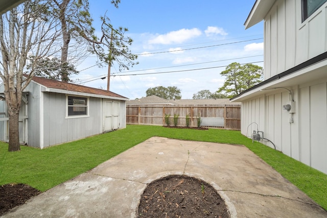 view of yard featuring an outdoor structure and a patio