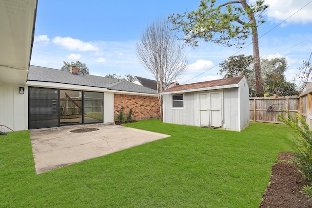 view of yard with a storage unit and a patio