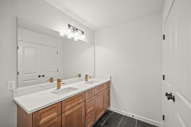 bathroom featuring tile patterned flooring and vanity