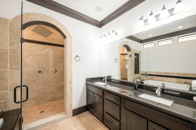 full bathroom with crown molding, tile patterned floors, a sink, and a shower stall