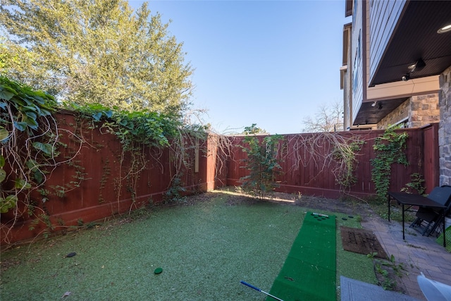 view of yard with a fenced backyard and a patio