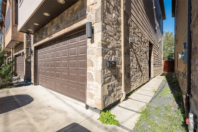 garage with concrete driveway