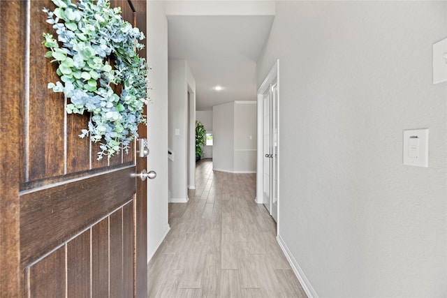 corridor featuring light hardwood / wood-style flooring