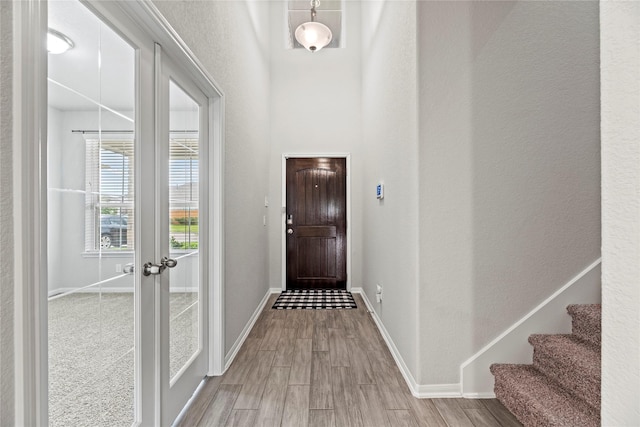 doorway featuring french doors and light wood-type flooring