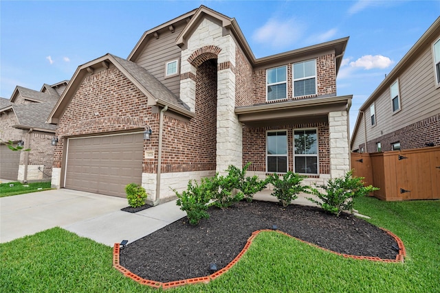 view of front facade with a garage and a front lawn