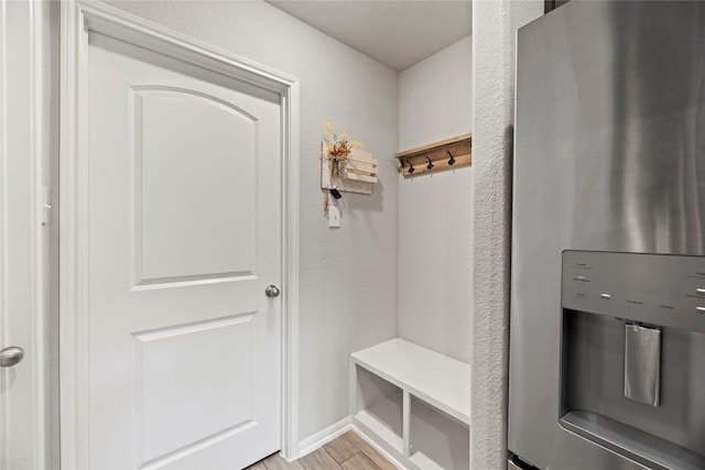 mudroom with light hardwood / wood-style flooring