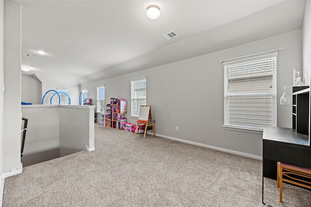 game room with light carpet