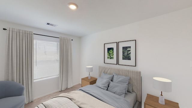 bedroom featuring baseboards, visible vents, and light colored carpet